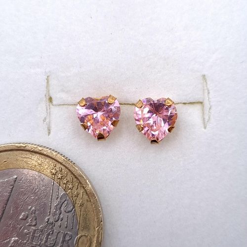 18 - A lovely pair of nine carat heart shaped pink tourmaline pair of stud earrings. Boxed.