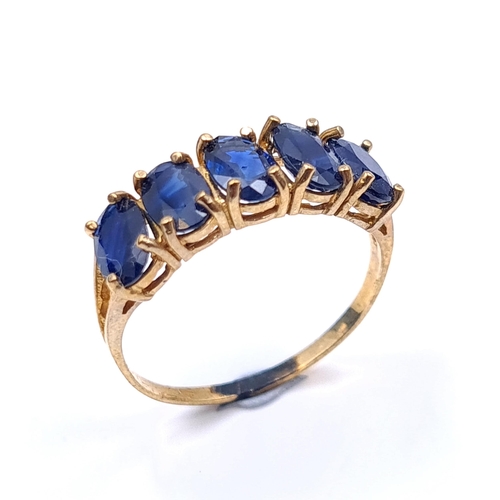 21 - Star Lot : A five stone sapphire ring marked 10 carat gold. Ring size - O. Weight - 1.68 grams. Boxe... 