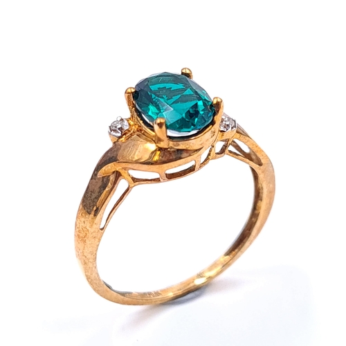 22 - Star Lot : A 10k gold ring marked to band with green gemstone setting set with gemstone accents. Rin... 