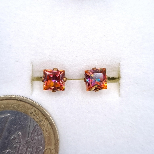 33 - A pair of beautiful nine carat gold mystic topaz stud earrings. Boxed.