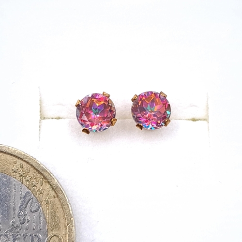 39 - A pair of stunning nine carat gold mystic topaz stud earrings. Boxed.