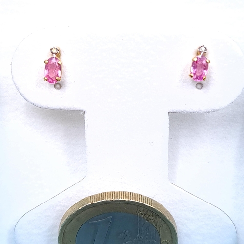 40 - A pair of nine carat gold pink tourmaline stud earrings. Boxed.