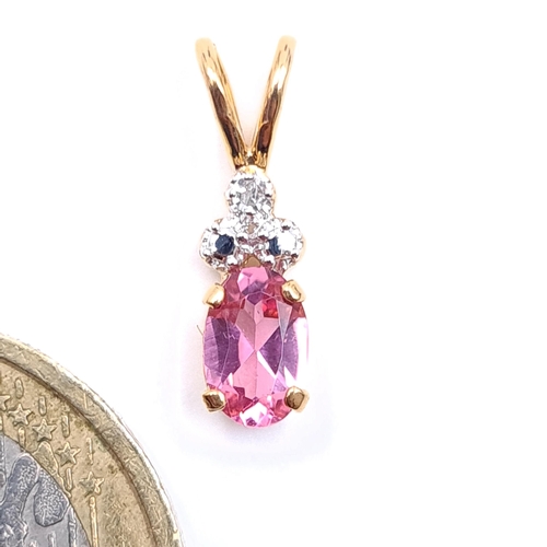 41 - Star Lot : A beautiful good size nine carat gold pink tourmaline and diamond set pendant. Boxed. Stu... 