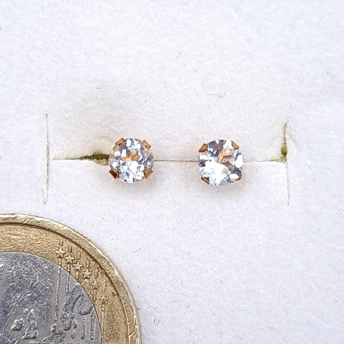 44 - A pair of nine carat gold gemstone stud earrings. Boxed.