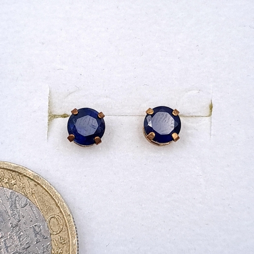 46 - A pair of nine carat gold sapphire stone stud earrings. Boxed.