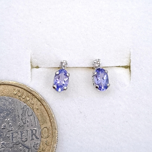 49 - A pair of silver tanzanite stud earrings. Boxed.