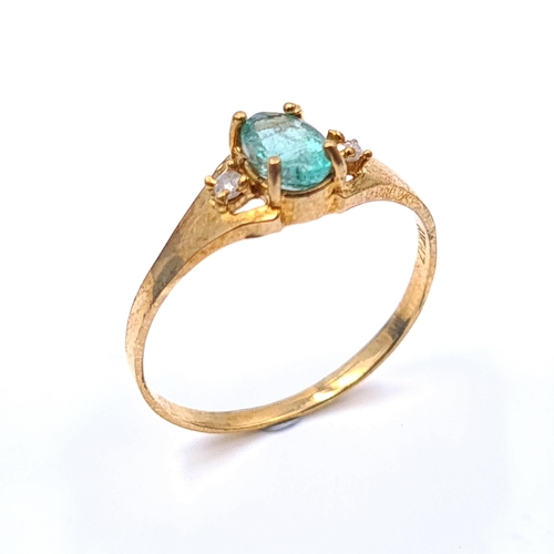 50 - Star Lot : A 10 carat gold ring 10K marked to band set with green tourmaline stone with diamond acce... 