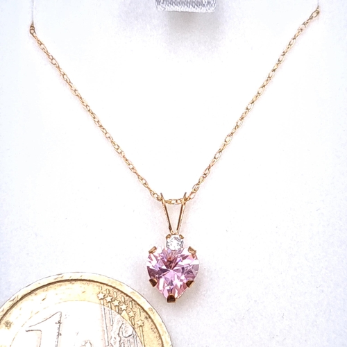 52 - A nice example of a heart shaped pink tourmaline pendant set with 9ct gold chain. Length - 44 cms. B... 