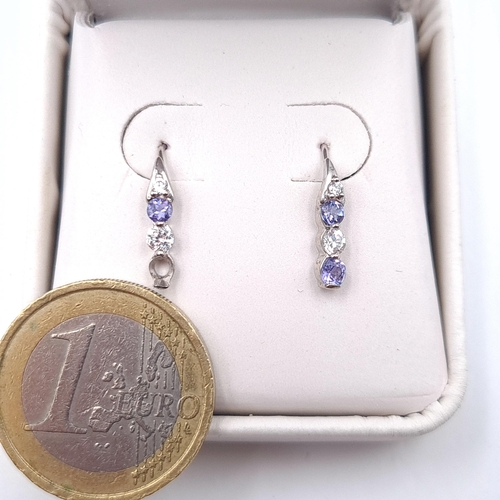 7 - A pair of tanzanite and gem set earrings (stone missing) suitable for pierced ears. Boxed.