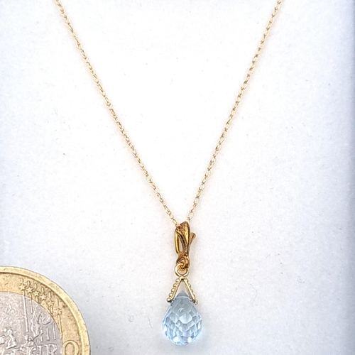 9 - An aquamarine drop pendant necklace set with 9ct gold chain. Boxed.