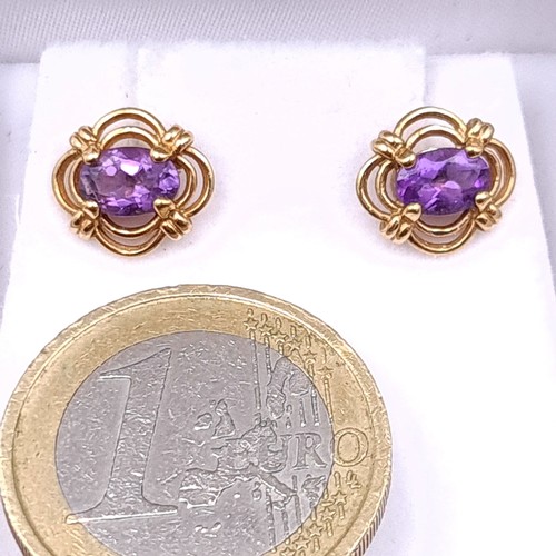 60 - A nice pair of lovely amethyst  antique hallmarked nine carat gold marked to posts stud earrings. We... 