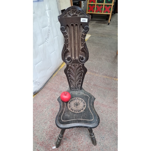 480 - An antique 19th century hand carved ebonised wood spinning chair with intricate botanical and fan mo... 