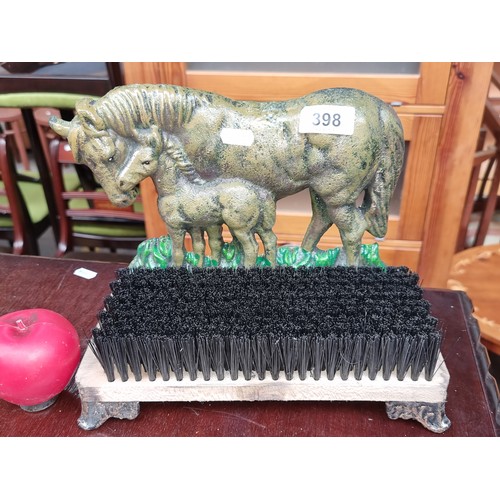 398 - A cast metal Horse Mare and Foal Door stop Shoes/Boots Brush scrub / Mud scraper.