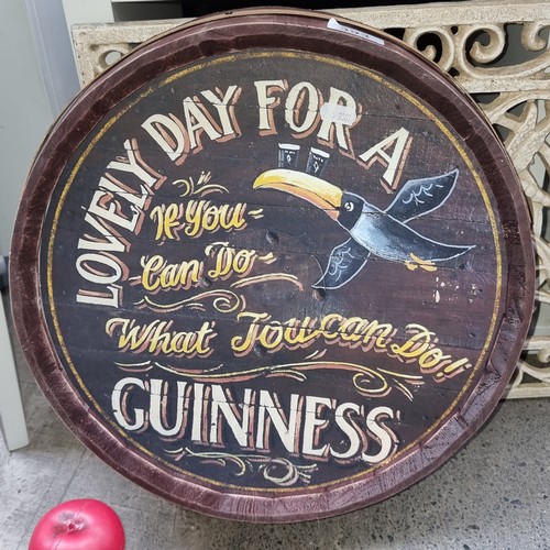 393 - A Guinness advertising barrel top featuring the iconic toucan