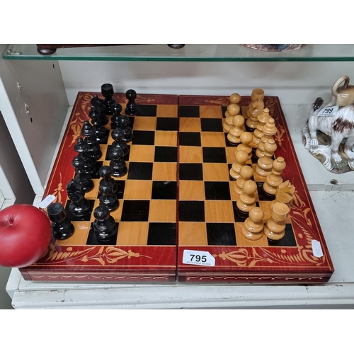 A superb hand carved rosewood chess set showcasing highly detailed carved detail throughout. Lovely set.