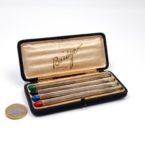 1044 - A fabulous set of four sterling silver Bridge pencils. Stamped 935 brittana silver. Housed in origin... 