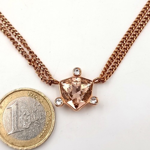 1075 - A Dyrberg Kern rose quarts pendant necklace. Boxed. Length of chain 46cm.