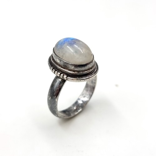 1079 - A sterling silver moonstone ring. Boxed. Size S.