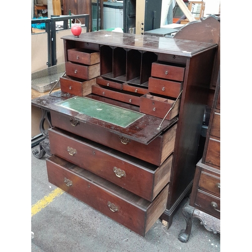 408 - Star Lot : A tall Georgian mahogany chest of drawers with a fitted secretaire, features brass handle... 