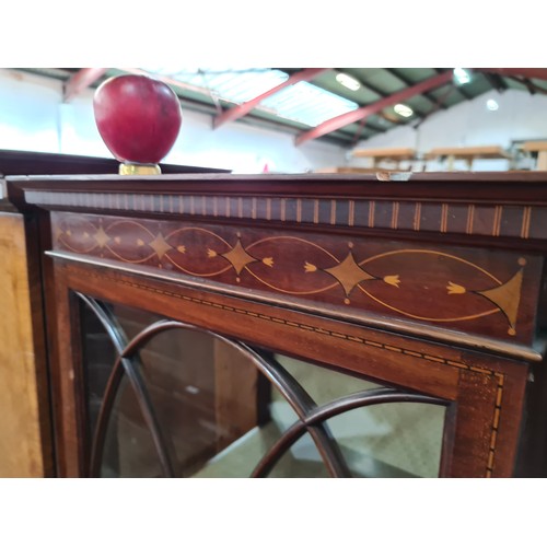 309 - Star Lot : A stunningly beautiful  Edwardian Mahogany display cabinet with curved glass doors, centr... 