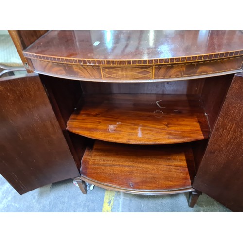 309 - Star Lot : A stunningly beautiful  Edwardian Mahogany display cabinet with curved glass doors, centr... 