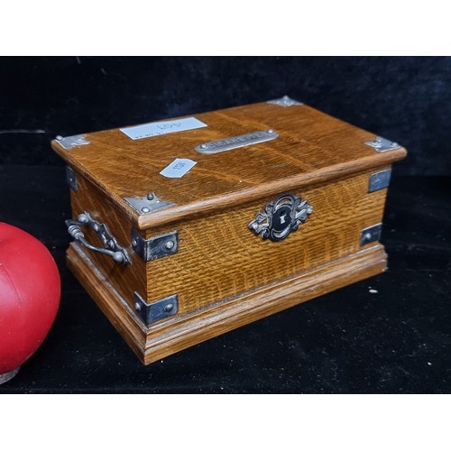 409 - A stunning early 20th century Oak Cigarette Box with white metal mounts and drop handles.