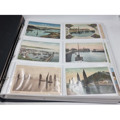 1067 - A large postcard album comprising of approx. 132 cards of Trawlers and Fishing Ports.