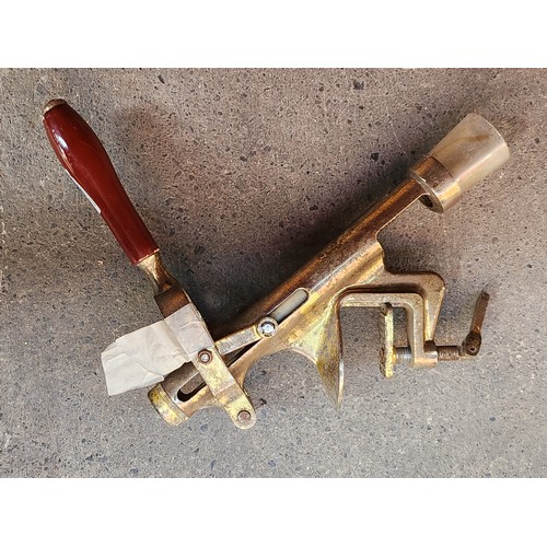 328 - A heavy vintage bar mounted cork screw.