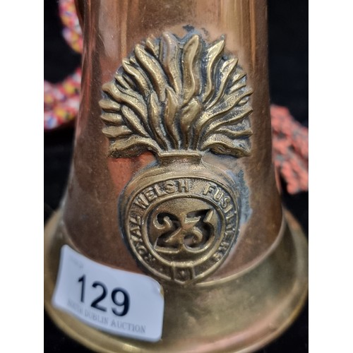 129 - A brass and copper Royal Welsh Fusiliers 23 Regiment signal military bugle. Nice colourful rope atta... 