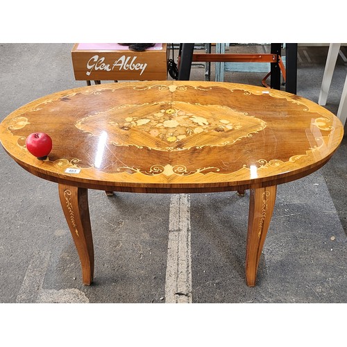 463 - Star Lot : A stunning Italian Sorrento oval inlaid wood coffee table. Featuring intricate floral mar... 