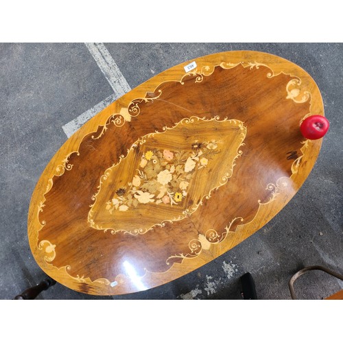 463 - Star Lot : A stunning Italian Sorrento oval inlaid wood coffee table. Featuring intricate floral mar... 