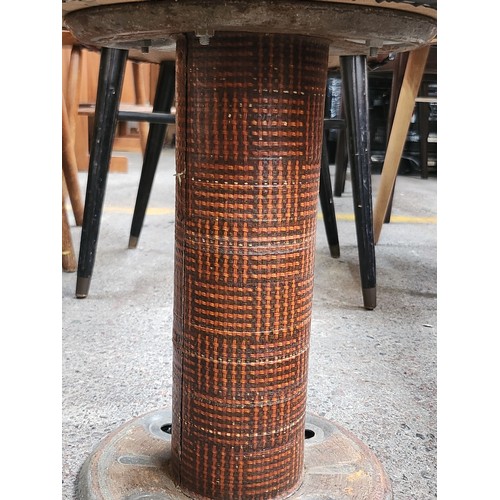 470 - A pair of vintage unusual black vinyl industrial style stools. Woven design column base.