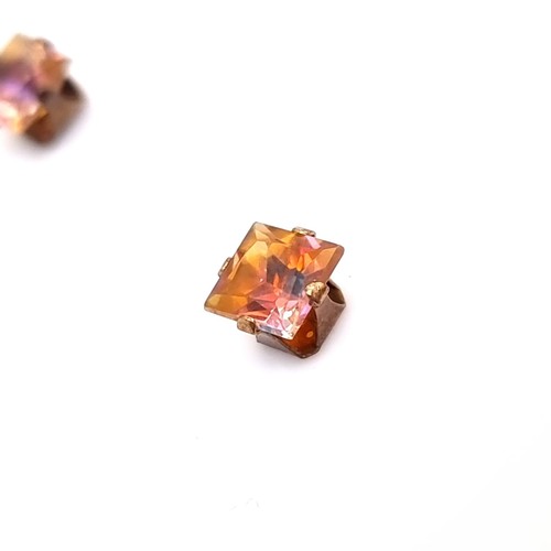 10 - A pair of nine carat gold mystic topaz stone stud earrings. Boxed.