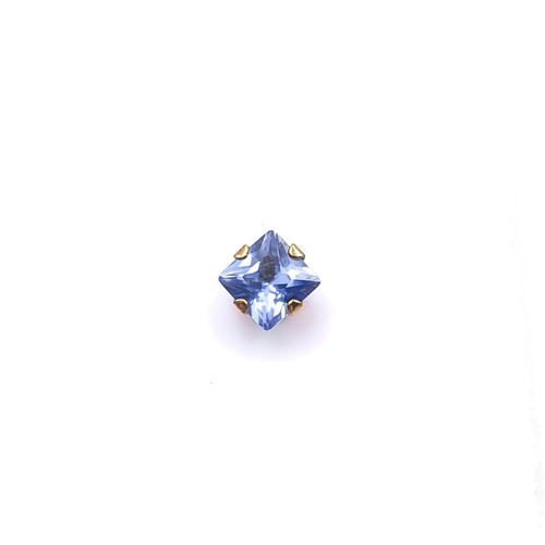 13 - A pair of nine carat gold tanzanite stone stud earrings. Boxed.