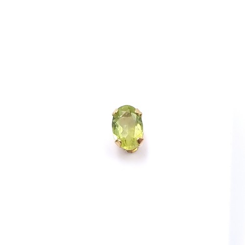 14 - A pair of nine carat gold Peridot stone stud earrings. Boxed.