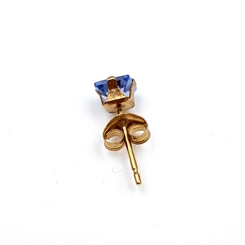 28 - A pair of nine carat gold blue Tanzanite stud earrings. Boxed.