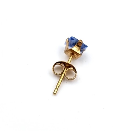 27 - A pair of nine carat gold blue Tanzanite stud earrings. Boxed.