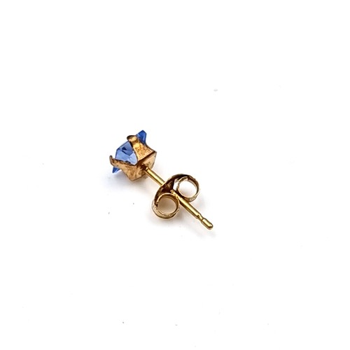 32 - A pair of nine carat gold blue Tanzanite stone stud earrings. Boxed.