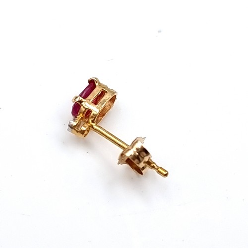 36 - A pair of nine carat gold ruby stone stud earrings. Boxed.