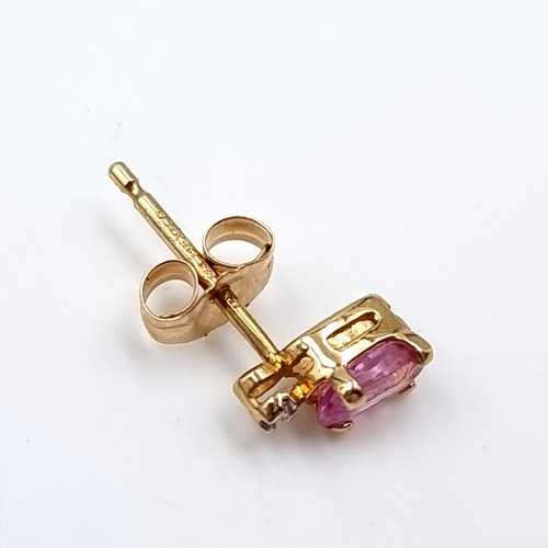 40 - A pair of nine carat gold pink tourmaline stud earrings. Boxed.