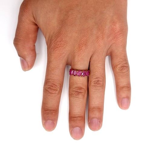 31 - Star Lot : A 10 carat gold ring marked 10K to band set with 5 large ruby stones. Ring size - N. Weig... 