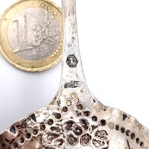 1049 - A Dutch silver caddy spoon. This piece is in the traditional Dutch style of a shallow ladle. The bow... 