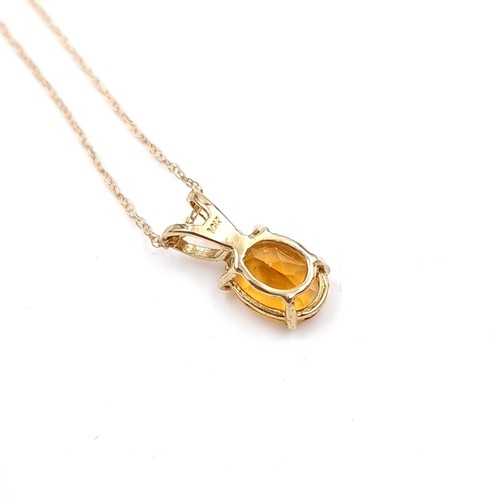 1 - Star Lot : A pretty citrine drop pendant set in nine carat gold together with a nine carat gold chai... 