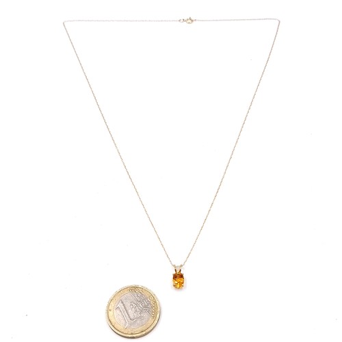 1 - Star Lot : A pretty citrine drop pendant set in nine carat gold together with a nine carat gold chai... 