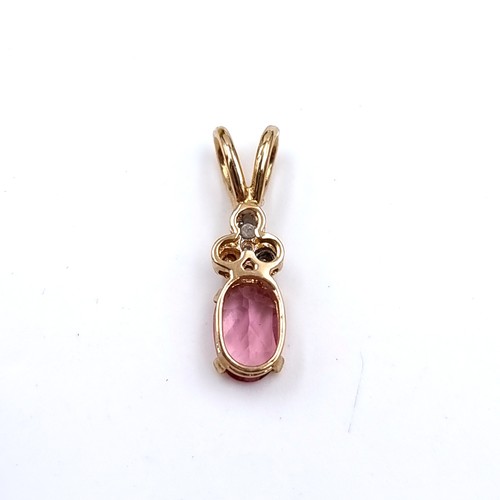 41 - Star Lot : A beautiful good size nine carat gold pink tourmaline and diamond set pendant. Boxed. Stu... 