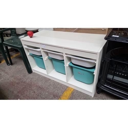 411 - White storage unit with three compartments. Each contains one white and one turquoise plastic bin. G... 