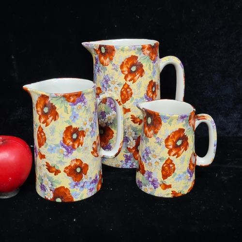 105 - Three very pretty Irish ceramic graduated jugs from 'Ballyporeen'. In beautiful chintz pattern.