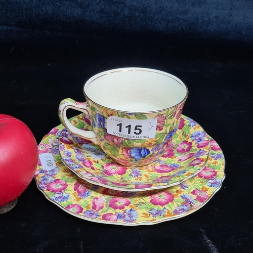 115 - A very pretty, early 20th century, Royal Winton chintz teacup, saucer and side plate. All stamped to... 