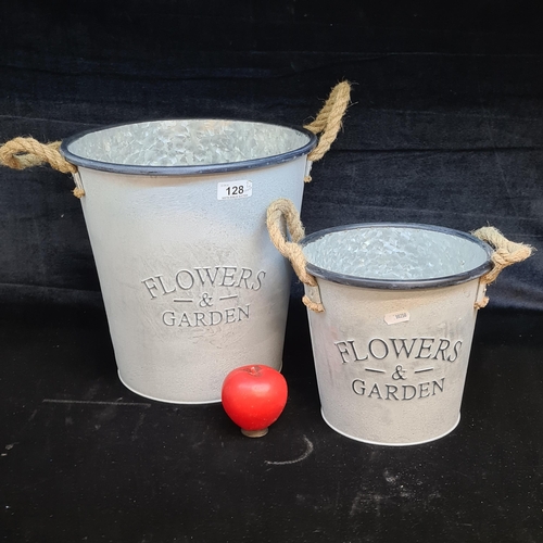 128 - Two graduate good galvanized steel garden buckets with rope handles to either side. Embossed 