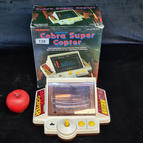 138 - A retro Tandy branded electronic Cobra Super Copter arcade game, complete in original box.